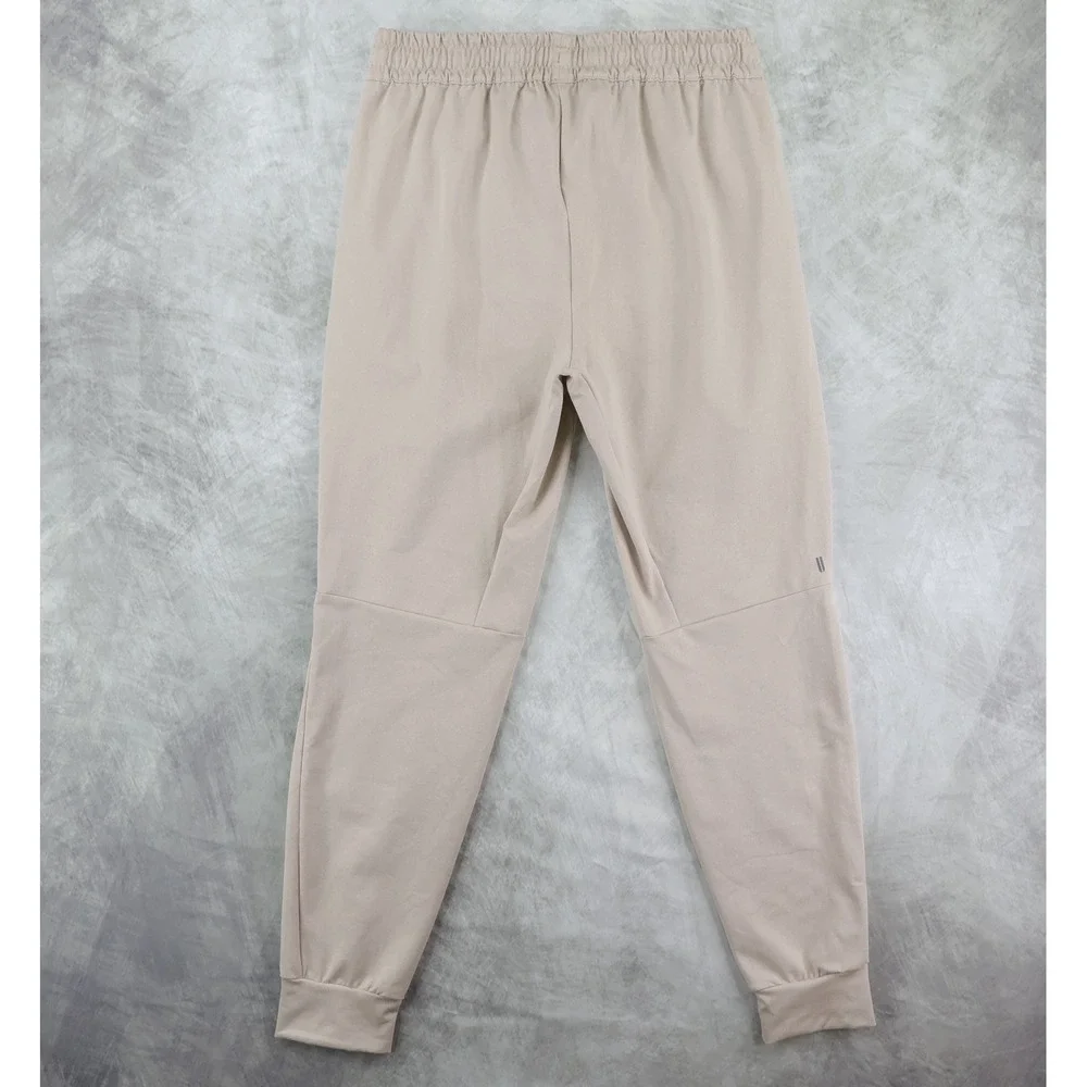 NOBULL Jogger Pants Mens Medium Tan Zipper Pockets Tapered Training Sweatpants